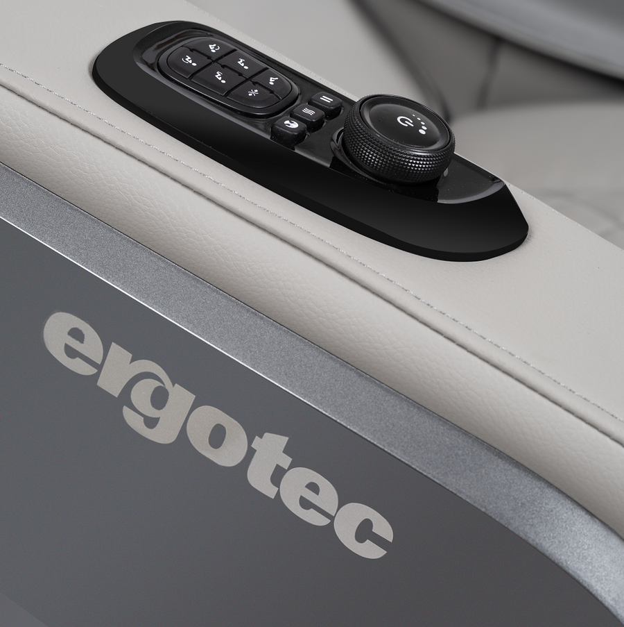 Close-up of ErgoTec ET-180 Pluto Massage Chair control panel with buttons and a dial.