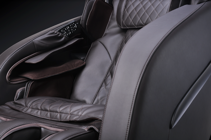 Close-up of ErgoTec ET-210 Saturn Massage Chair with built-in remote and full-body massage.