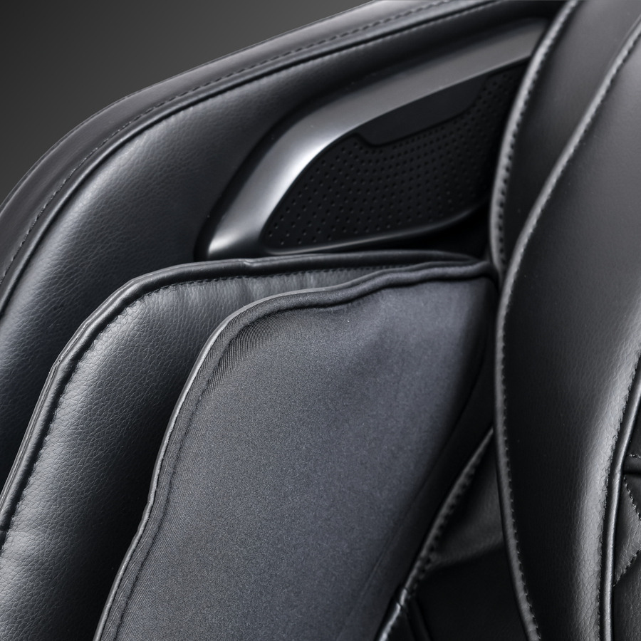 Close-up of ErgoTec ET-400 Venus black leather cushion and 3D L-Track on massage chair.