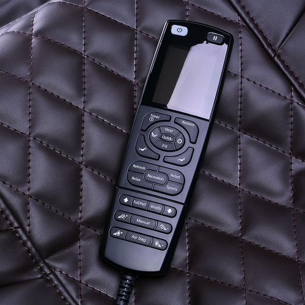 ErgoTec ET-150 Neptune Massage Chair features a black remote control on its brown quilted surface.