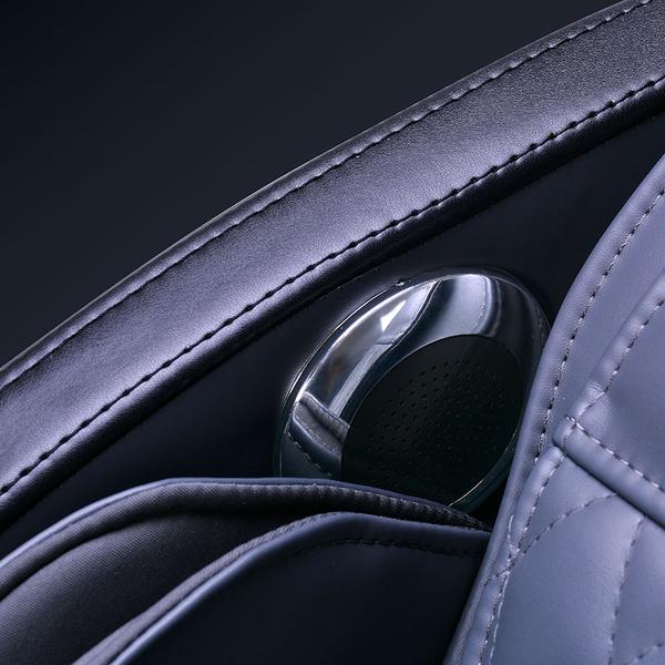 Close-up of ErgoTec ET-150 Neptune gray massage chair seat with built-in cup holder.